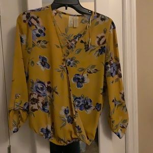 Gold with flowers blouse size small long sleeve criss cross at top